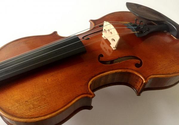Front of VN-103 violin with antiquing