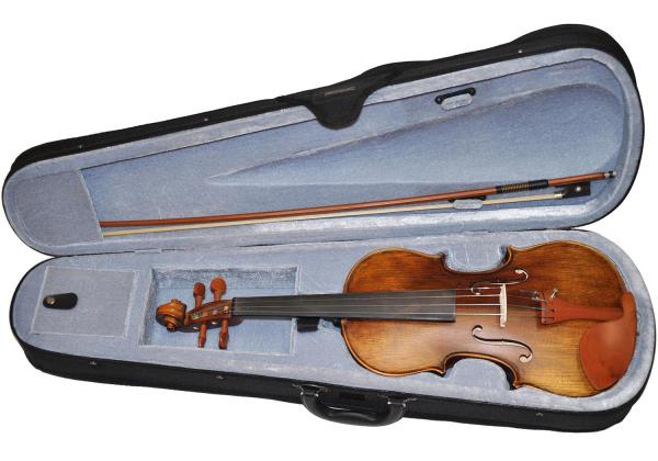 Antiqued brown violin in a student case with a bowAntiqued brown violin in a student case with a bow