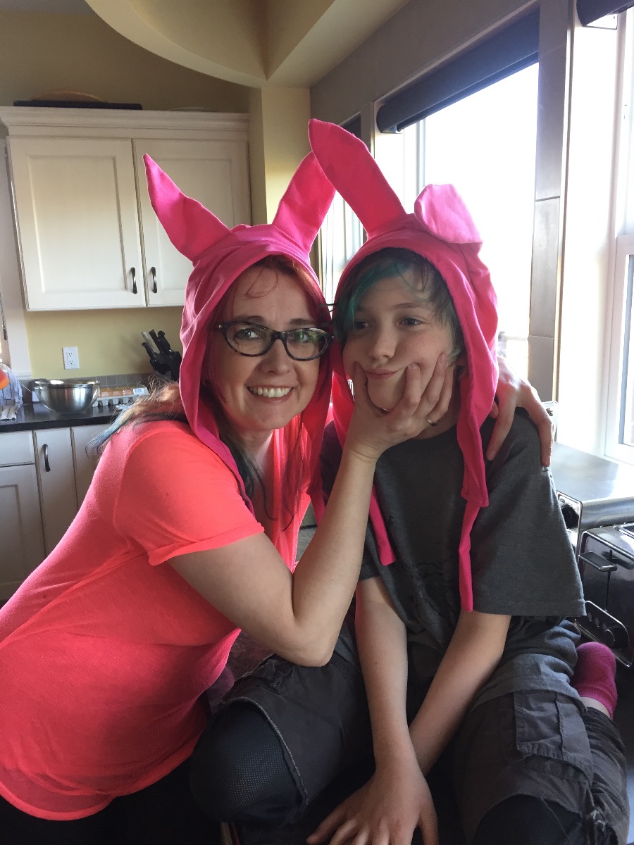 Rhiannon and her son wear hot pink bunny ears like Louise on Bob's Burgers