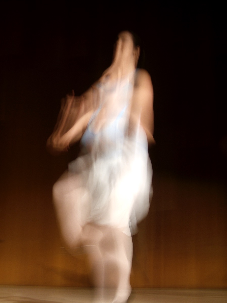 Blurred art photo of a woman dancing