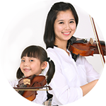 Woman and little girl back to back playing violin