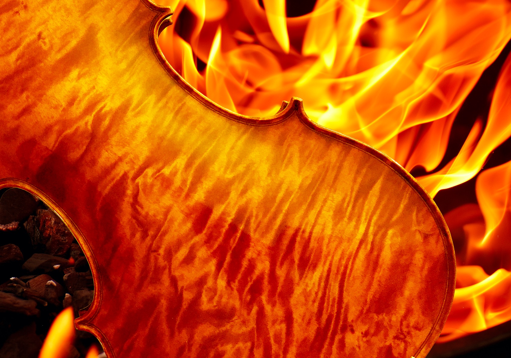 Violin with marbled flame over a similar looking campfire