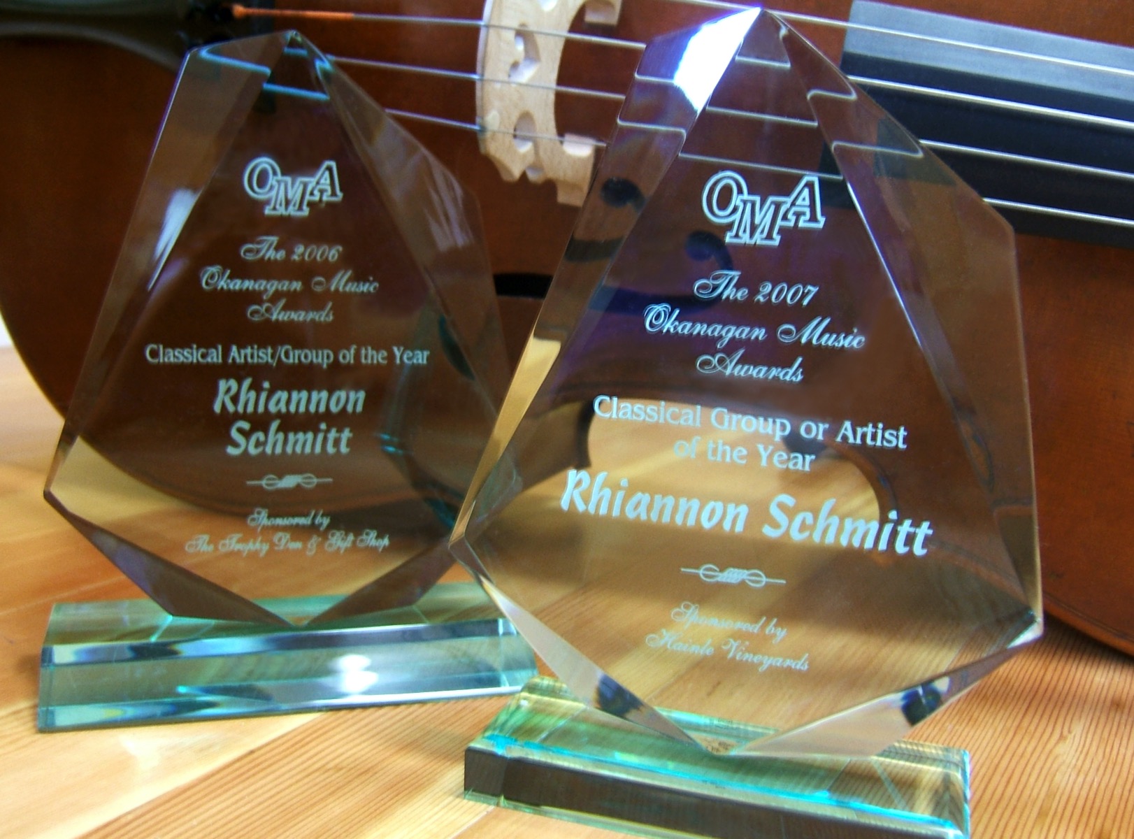 two glass trophies side by side with Rhiannon's name