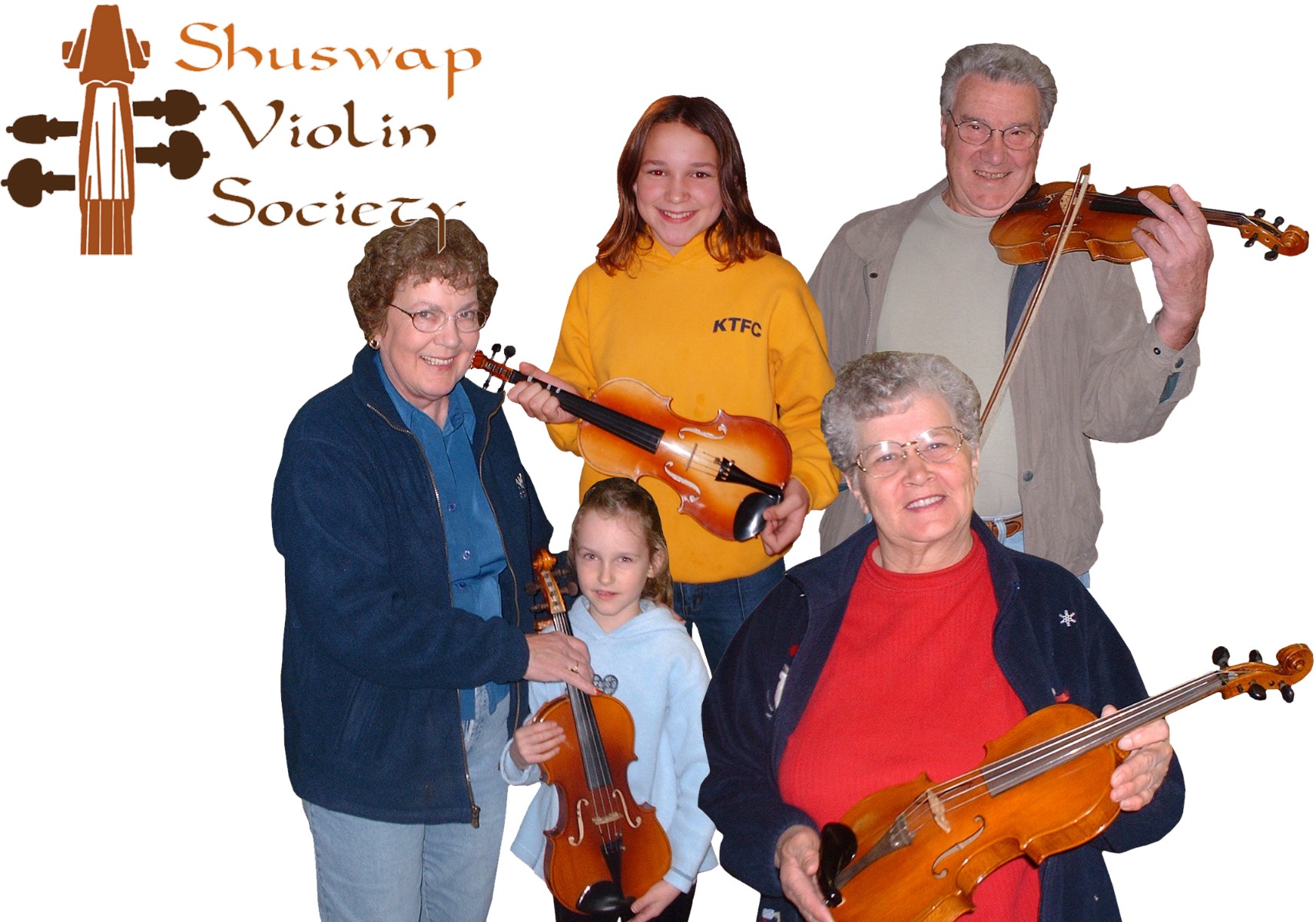 various seniors and children holding violins they have donated