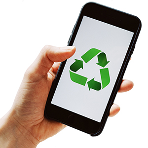 hand holding an digital device with a green recycling logo on the screen