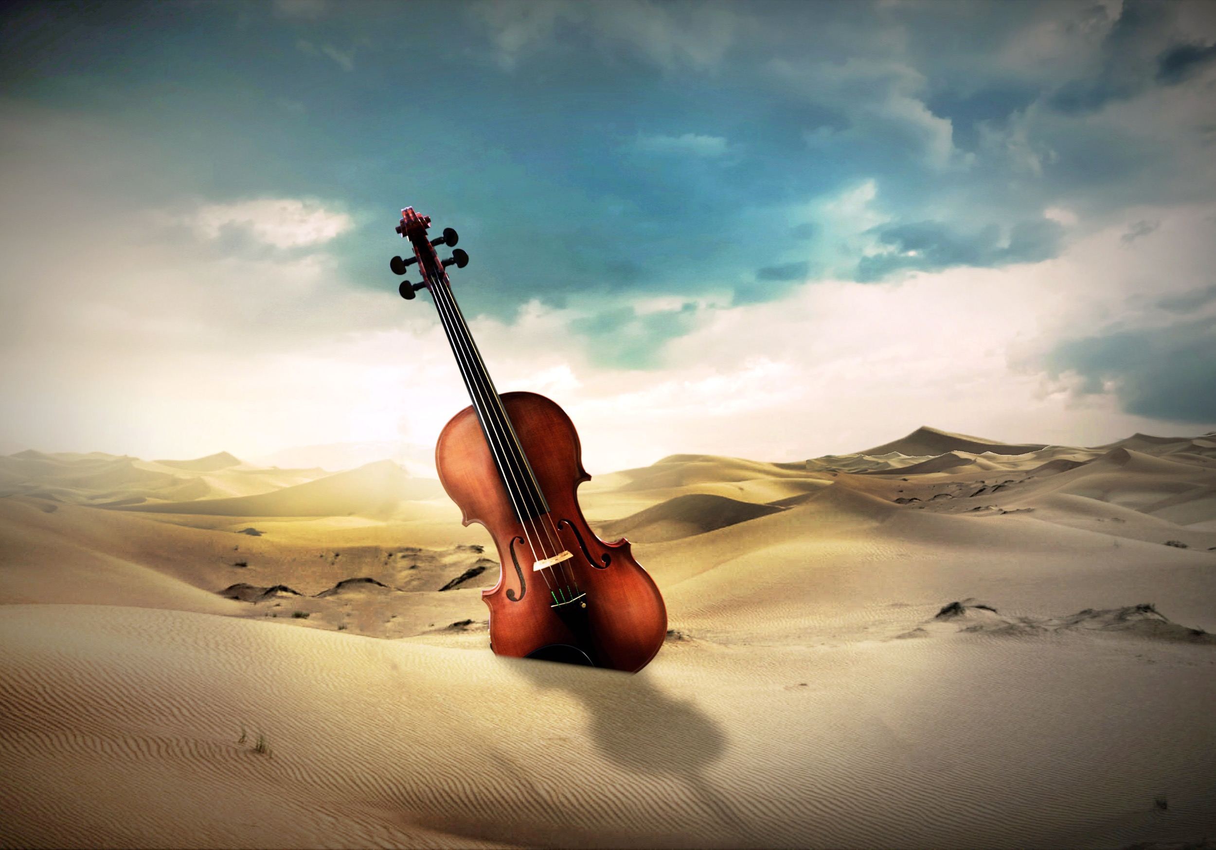 giant violin in a sandy desert with dark clouds overhead