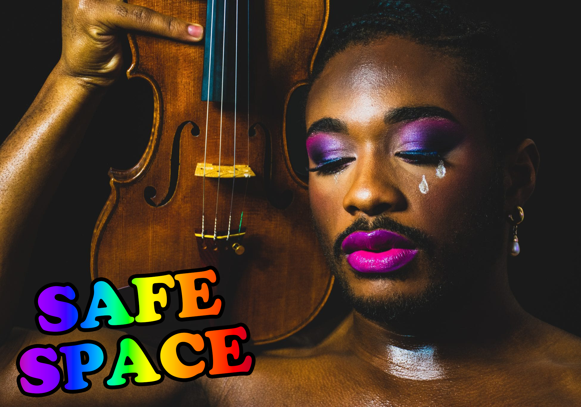 a beautiful black person wearing vivid purple eye makeup and lipstick with two white tears painted on their cheek holds a violin propped upright over their right shoulder; rainbow text reads "SAFE SPACE"