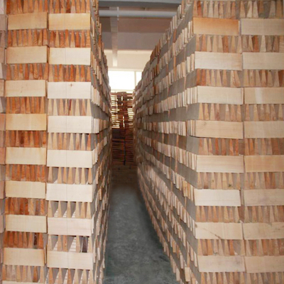 stacks of blocks of wood drying naturally in storage