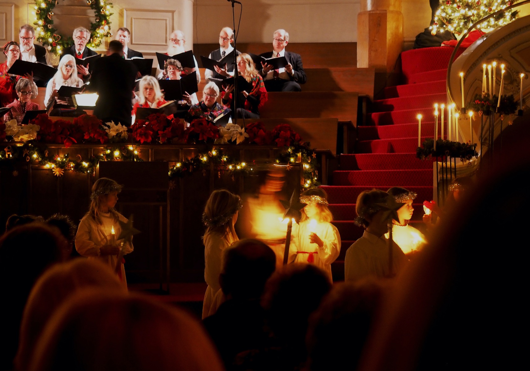 Church singers by candlelight