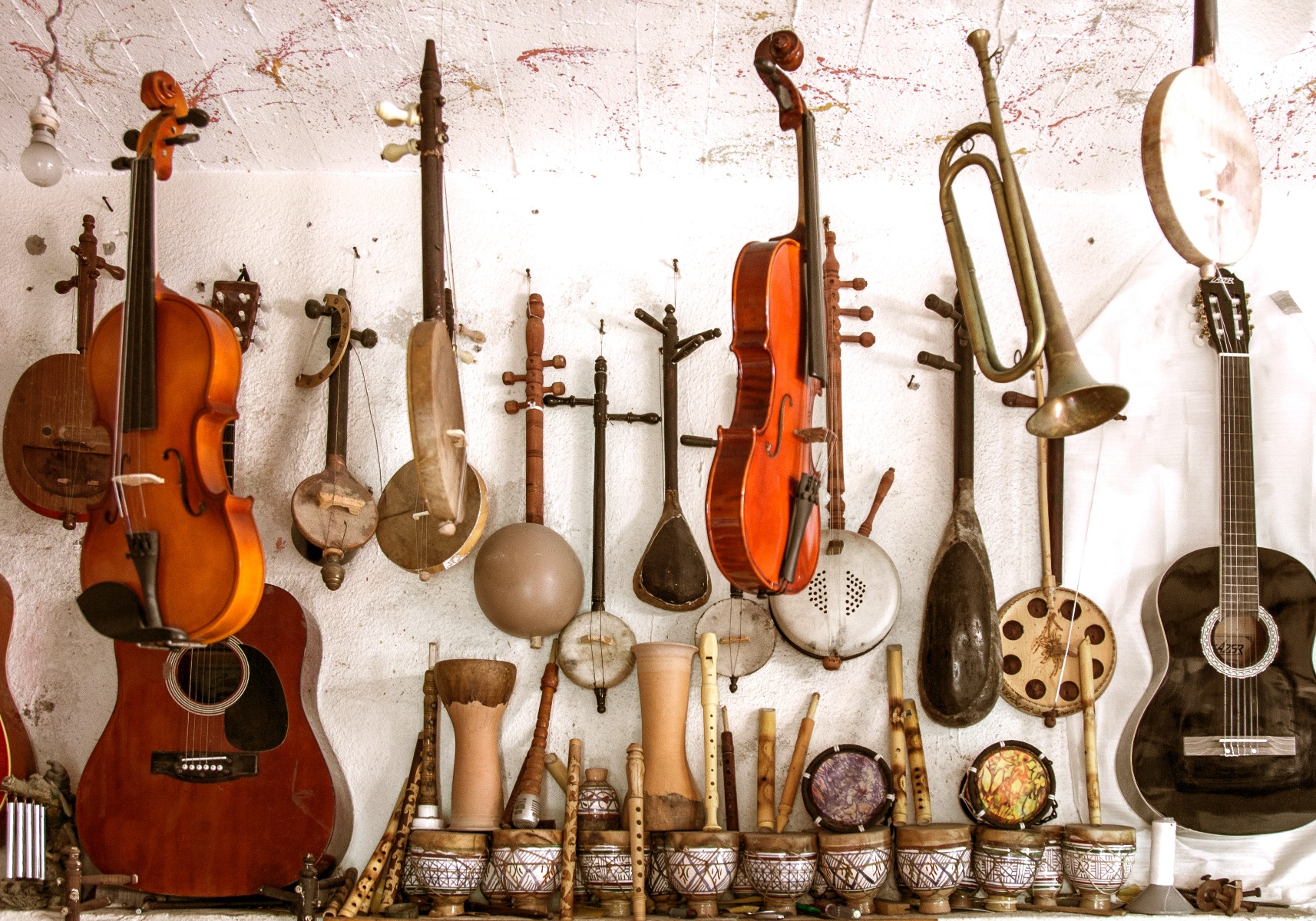 Assortment of various instruments hanging from a wall