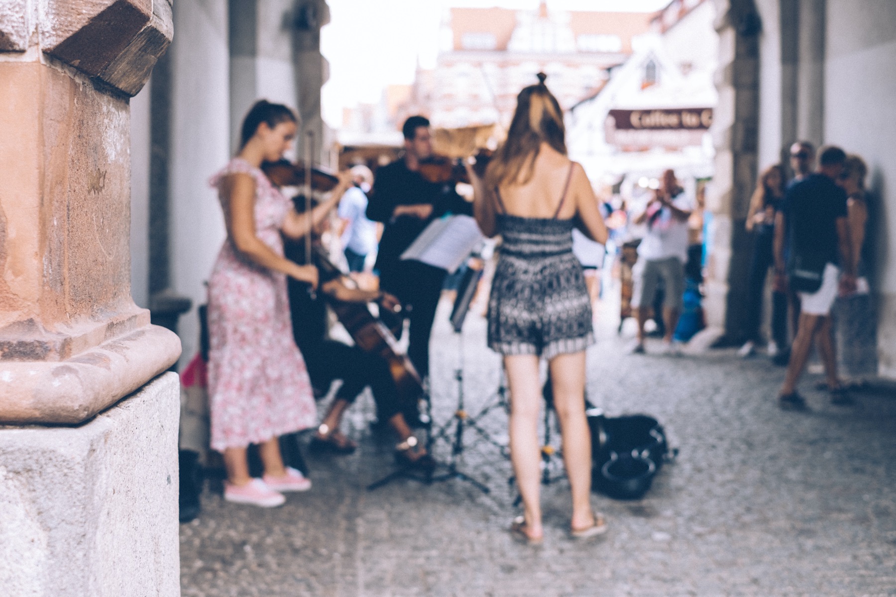 Group of young violinists busking