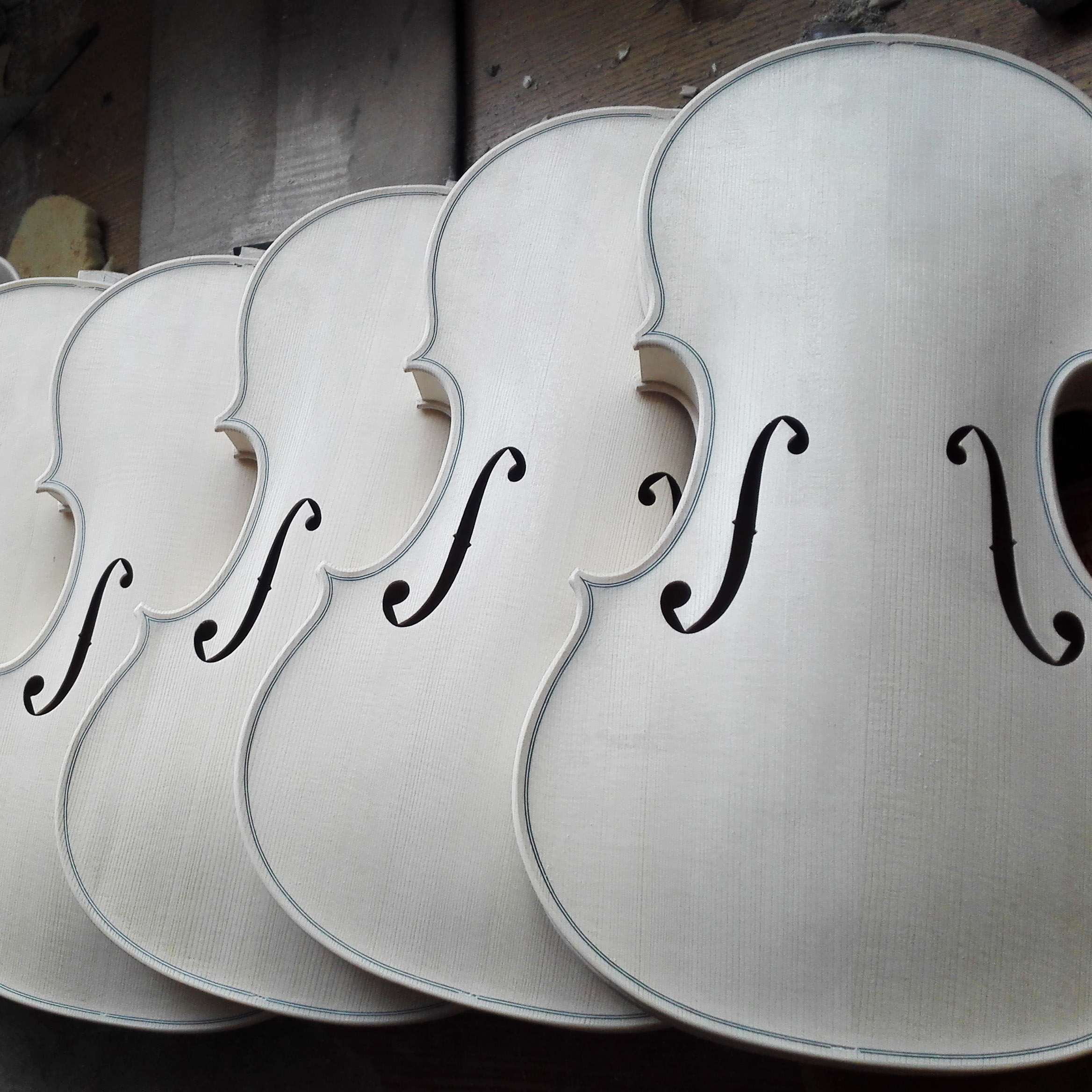 White, unfinished violins 